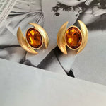 Oval Sparkling Crystal Earrings: orange oval crystals in gold crescent frames