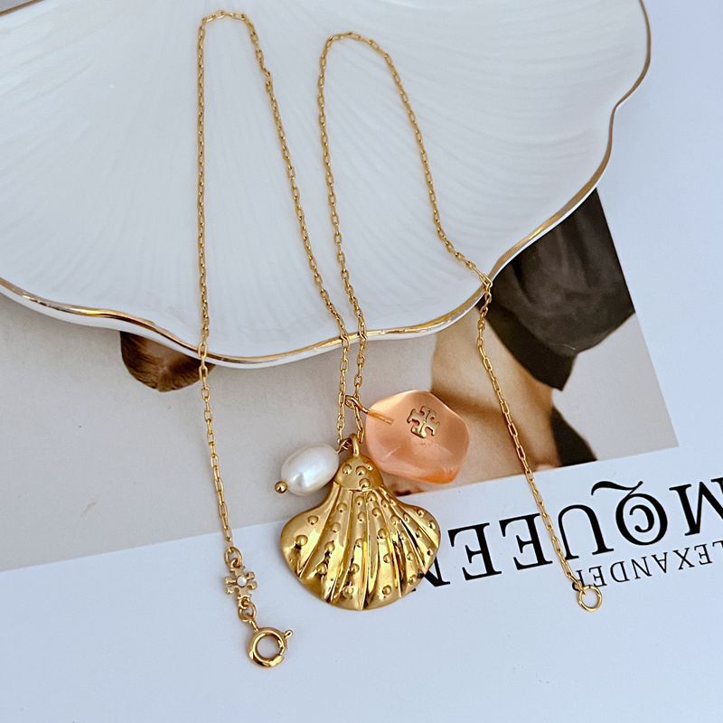 Gold-tone shell pendant necklace with pink acrylic bead and white freshwater-style pearl