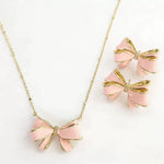 Bow pendant necklace with pink enamel and white pearl drop, with stud earrings