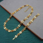 Gold-tone chain necklace with oval blue beads and decorative side clasp details