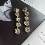 Clear heart-shaped crystal drop earrings with gold-tone chain