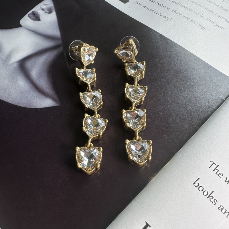 Clear heart-shaped crystal drop earrings with gold-tone chain