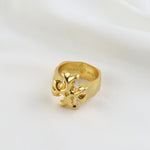 Matte gold vintage ring, angled side view with detailed cutout logo motif