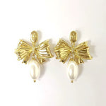 Gold-tone bow pearl drop stud earrings with white pearl and rhinestone center