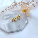 Gold heart stud earrings, matte finish, butterfly back clasp visible
