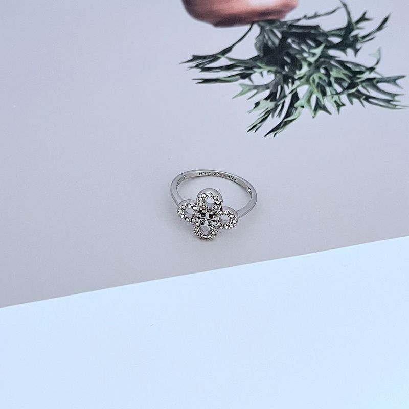 White gold clover flower metal ring with round diamond accents, open band