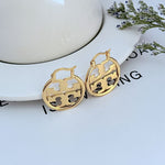 Gold-tone openwork logo metal hoop earrings with enamel-inlaid circular design