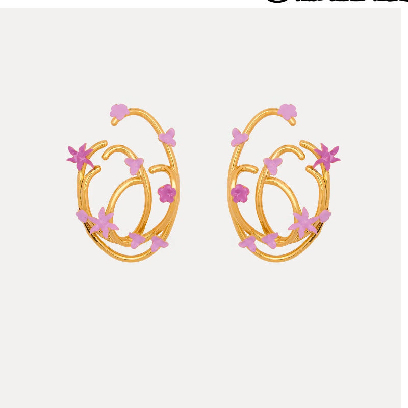 Pink enamel geometric hoop earrings with star and flower motifs