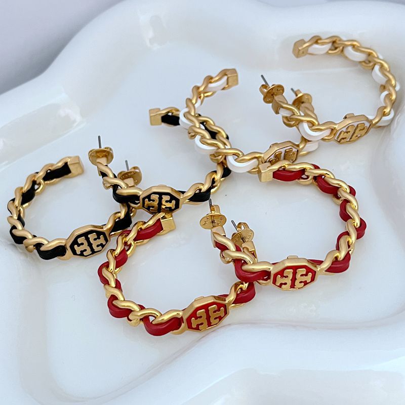Logo hoop earrings, gold chain with red and black enamel accents