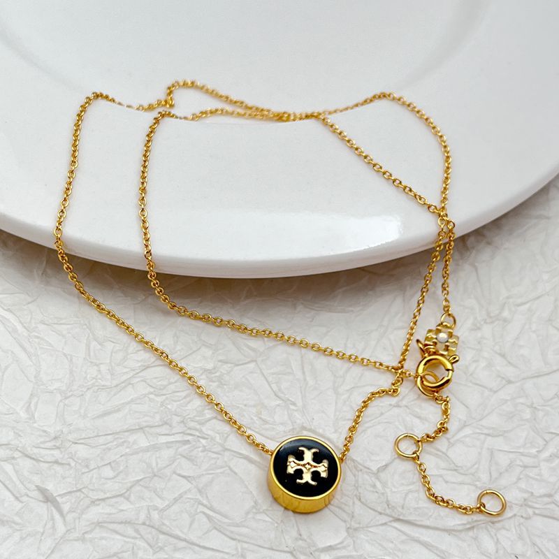 Gold-tone round enamel charm necklace with logo medallions and layered chains