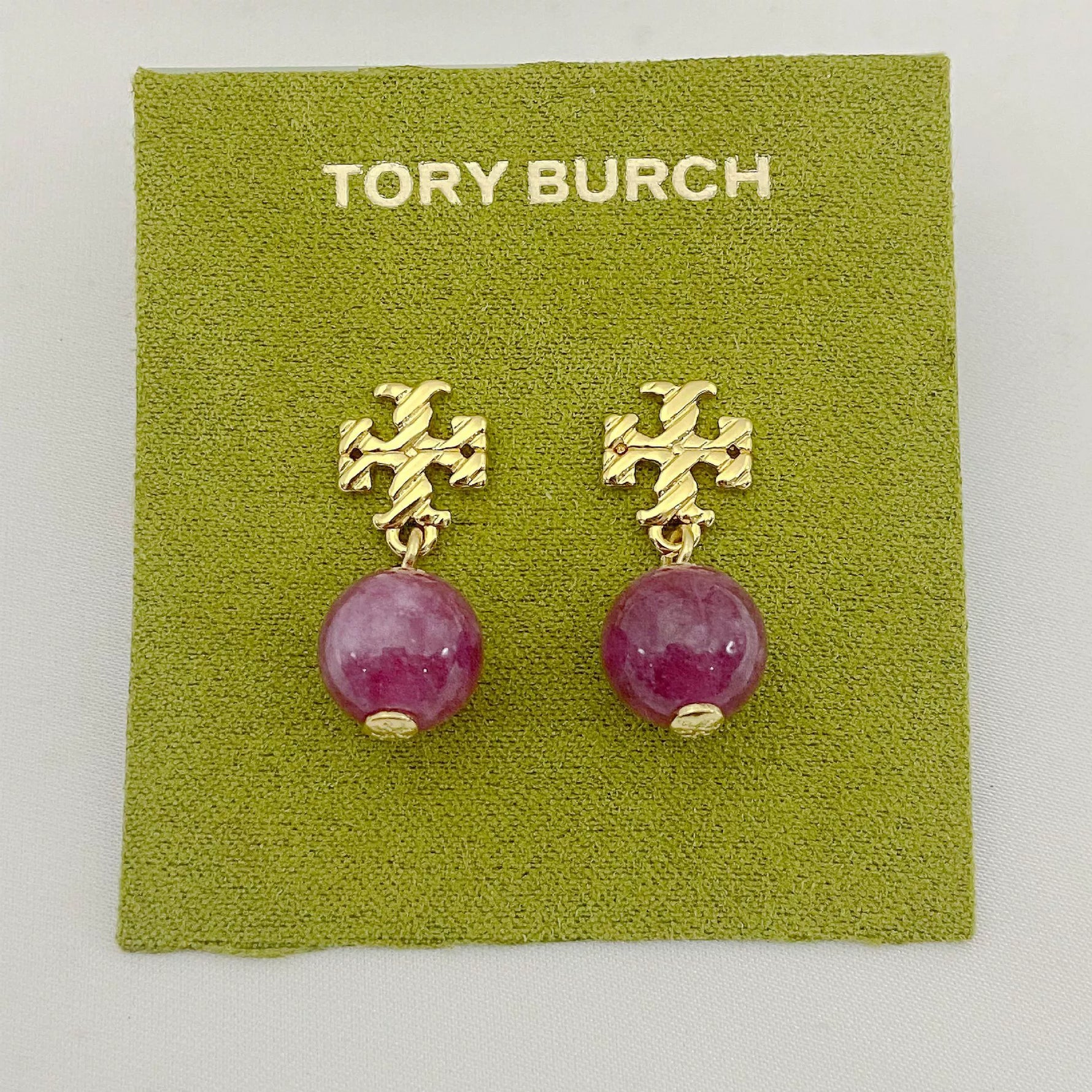 Purple-red round agate pendant earrings with gold-tone geometric drop details