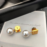 Gold square tag pearl earrings with white round pearl drops