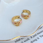Enamel logo hoop earrings, pink enamel with gold-tone logo, pair view