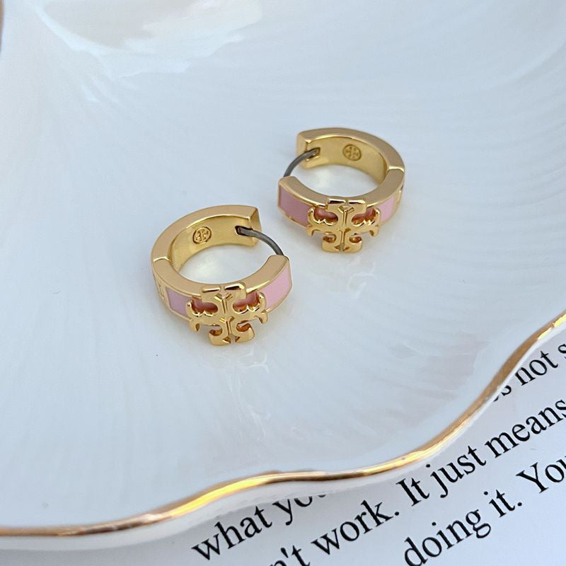Enamel logo hoop earrings, pink enamel with gold-tone logo, pair view