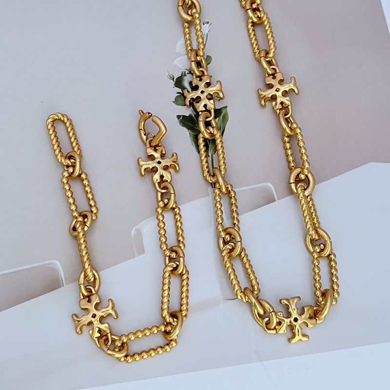 Gold-toned chunky chain bracelet/necklace with square logo link charms