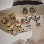 Gold and silver star-moon pendant earrings set: sunburst tops, pearls, crescent moons