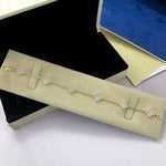 Gold-tone clover bracelet with lavender agate clover links and four-leaf motif chain