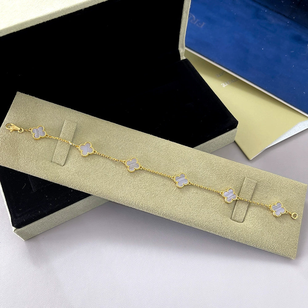 Gold-tone clover bracelet with lavender agate clover links and four-leaf motif chain