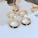Tory Burch enamel logo hoop earrings, gold-tone with black enamel accents and small studs