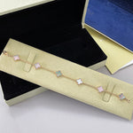 Rose tone bracelet with pastel pink clover charms on a delicate chain