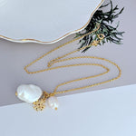 Tory Burch logo pendant necklace, gold-tone chain with white baroque pearls