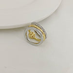 Two-tone three-band metal ring with gold and silver stacked bands