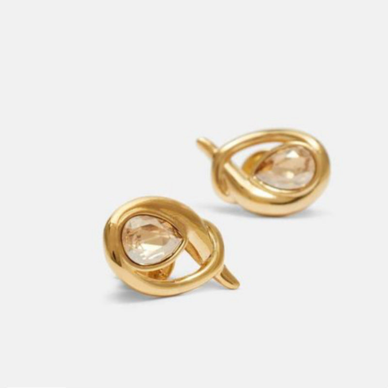 Gold looped teardrop earrings with champagne teardrop gemstone, angled view