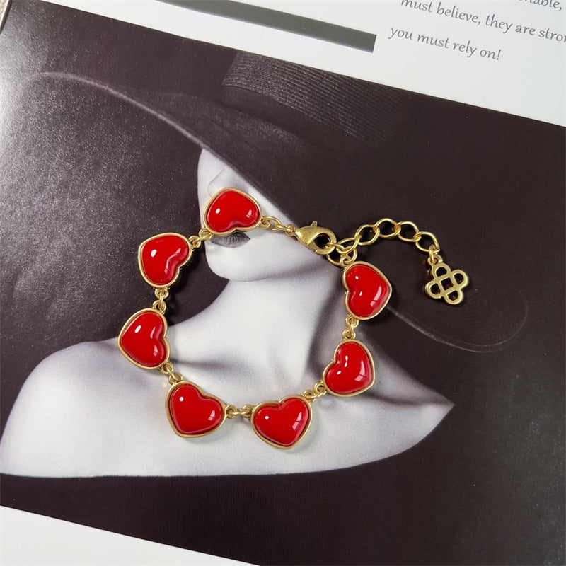 Red matte heart bracelet, gold-tone chain with red heart charms