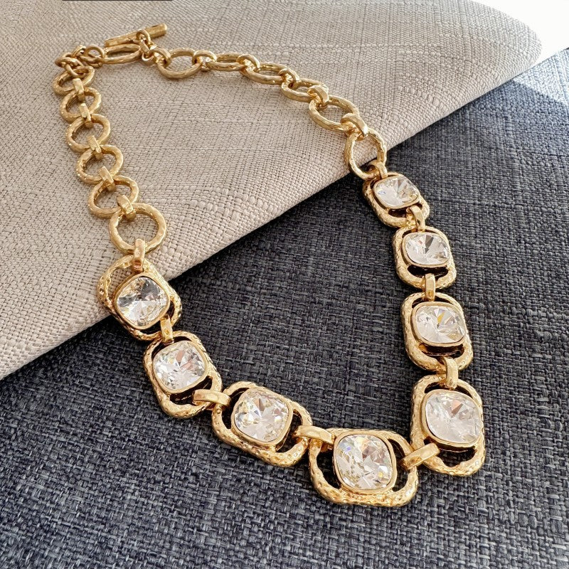 Gold link necklace with clear faceted crystal oval stations