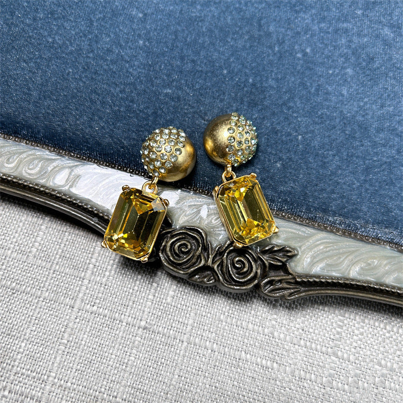 Earrings with yellow rectangular stones and gold stud caps, square pendant drop