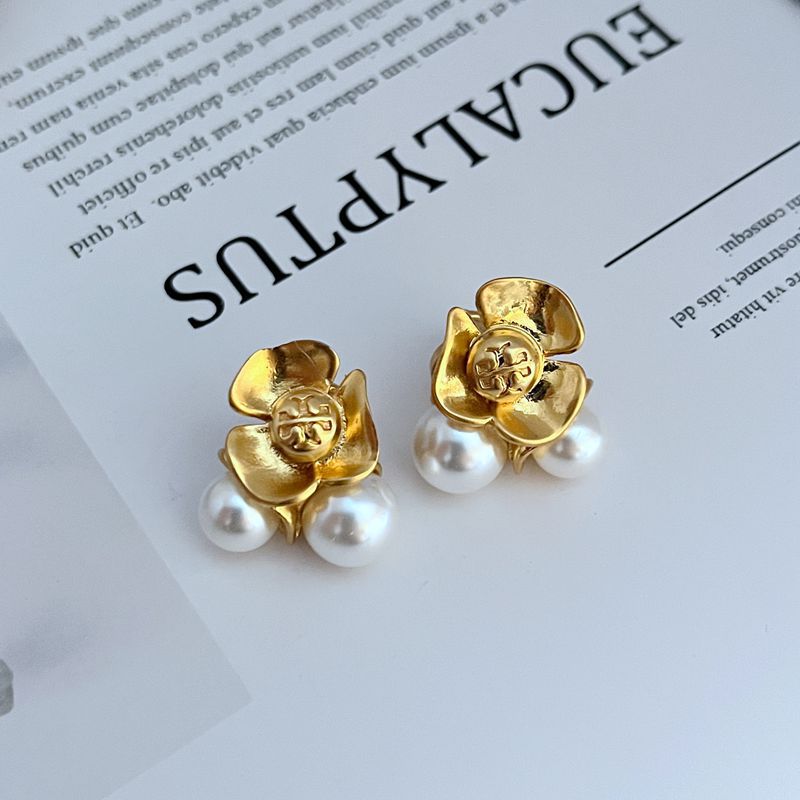 Gold metal flower stud earrings with white pearl accents, pair