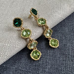Full-crystal square drop earrings with green stones and gold-tone accents