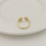 Tory Burch rhinestone round logo ring, gold-tone with two round logo medallions