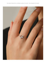 Silver adjustable chain ring on finger with Arabic letter pavé charm and thin linked band