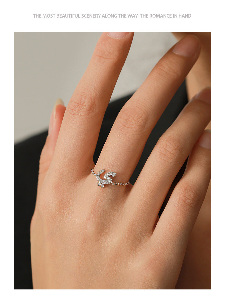 Silver adjustable chain ring on finger with Arabic letter pavé charm and thin linked band