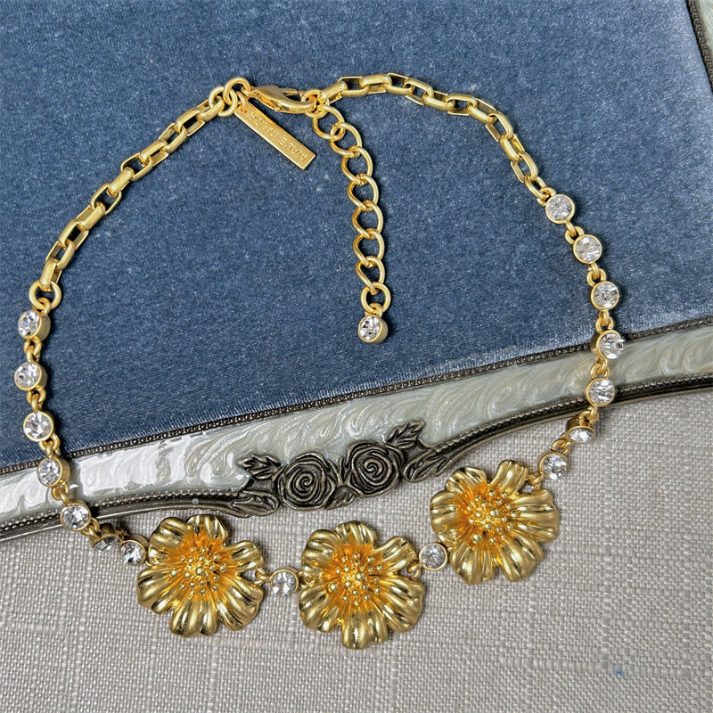 Enamel cherry blossom pendant necklace with gold-tone flowers and clear round rhinestone links