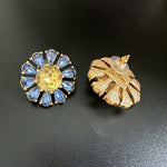 Sunburst flower stud earrings with blue teardrop stones and yellow center, gold-tone pair