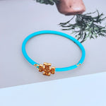 Blue enamel openable bangle with diamond-set gold cross charm