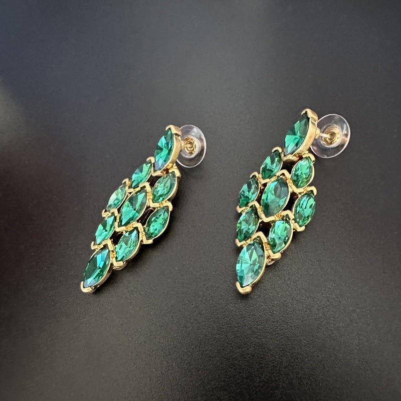 Oscar de la Renta stud earrings, green marquise rhinestones in a diamond pattern