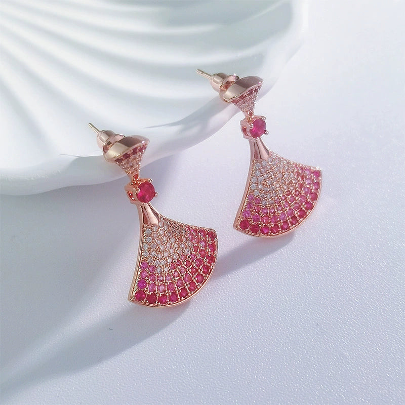 Rose gold fan rhinestone earrings with pink gem accents