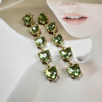 Green heart-shaped crystal drop earrings, gold-tone links