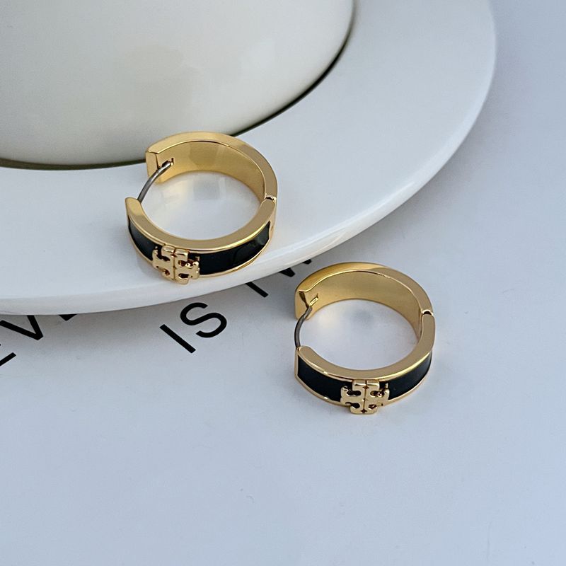 Gold-tone enamel hoop earrings with black round band and small gold emblem