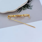 Gold metal hair clip with pavé bar detail and clasp, long pin tip
