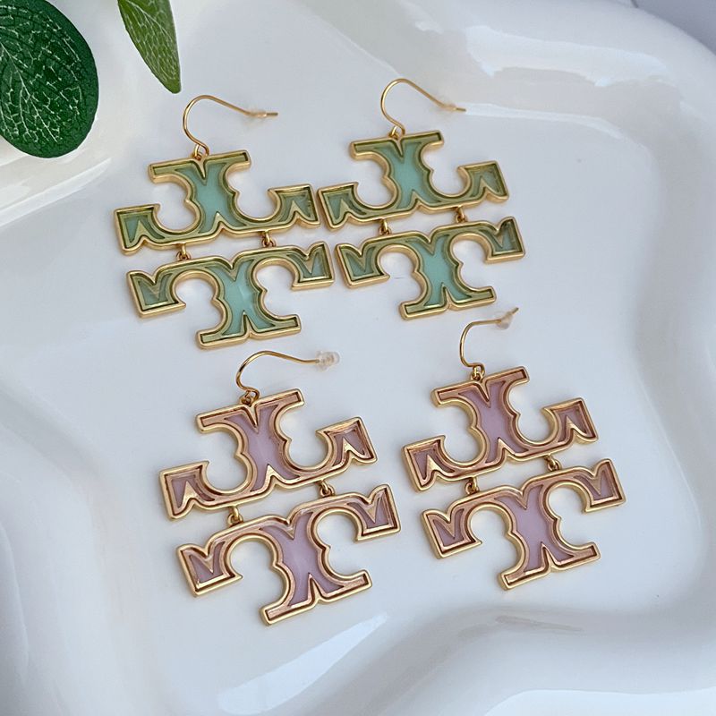 Green logo drop earrings, gold-tone metal, curved ear hook style