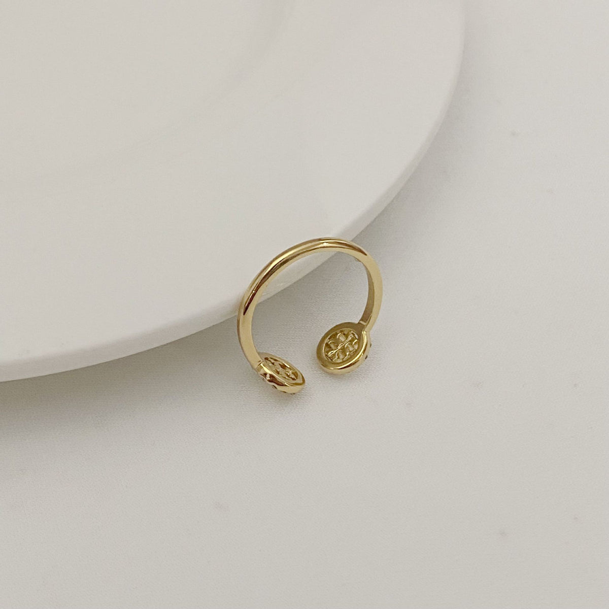 Tory Burch rhinestone round logo ring, gold-tone open band with logo face detail