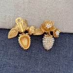 Gold strawberry clip-on earrings with crystal rhinestone strawberries, flower caps and faux pearls
