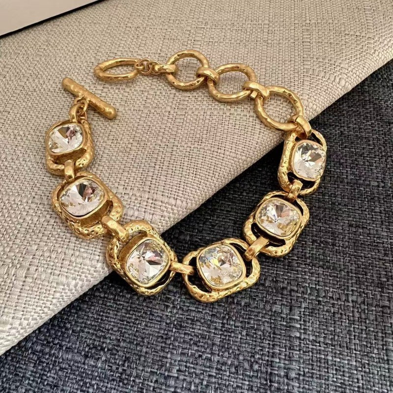 Square crystal toggle bracelet with clear/white stones and gold link settings