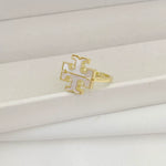 Gold logo ring with interlocking geometric cutouts and openwork front
