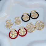 Logo hoop earrings with enamel-inlaid discs in red, black, and white on gold-tone metal