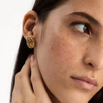 Looped teardrop earrings in gold tone with light champagne teardrop stone